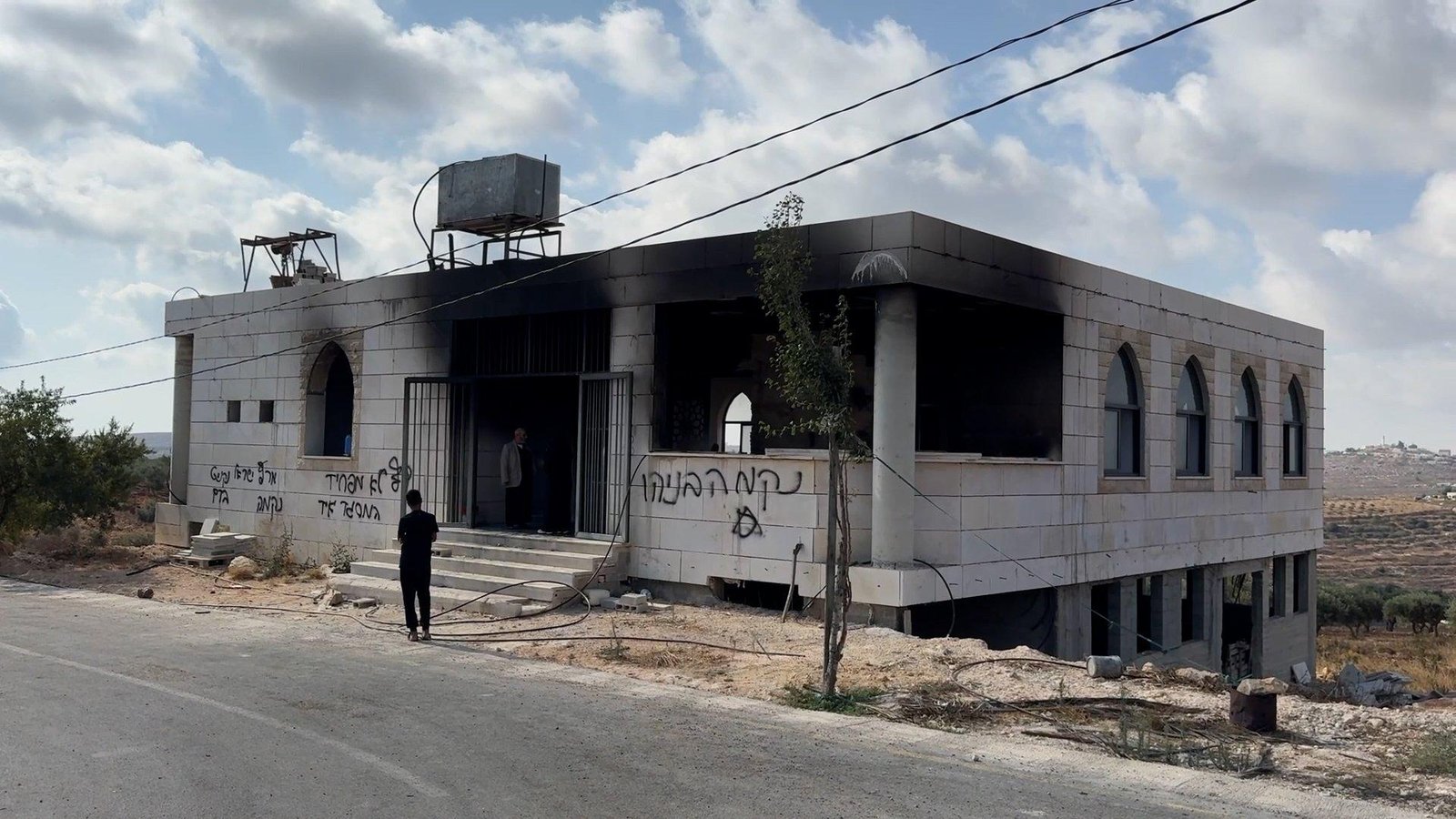 Israeli settlers burn two mosques in occupied West Bank
