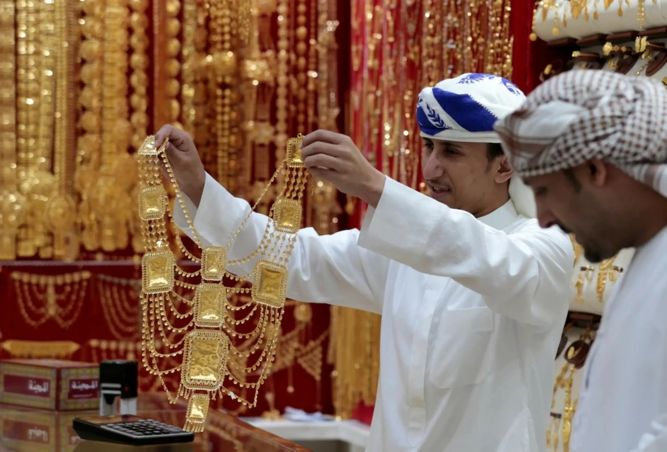 Gold slips from two-week peak