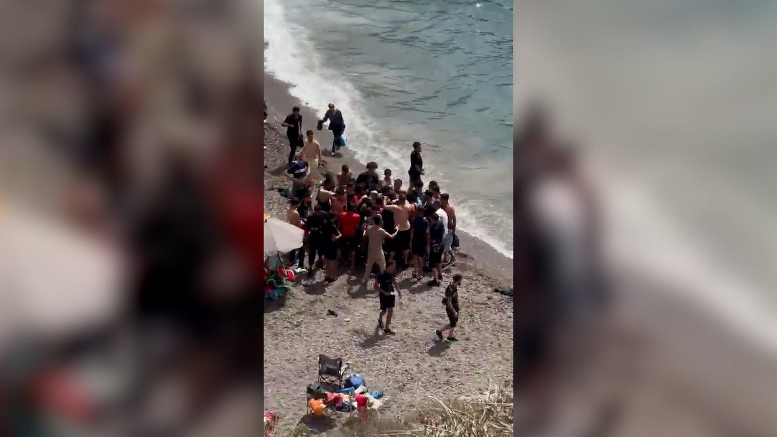 Dozens of migrants land on Spanish coast surprising beachgoers