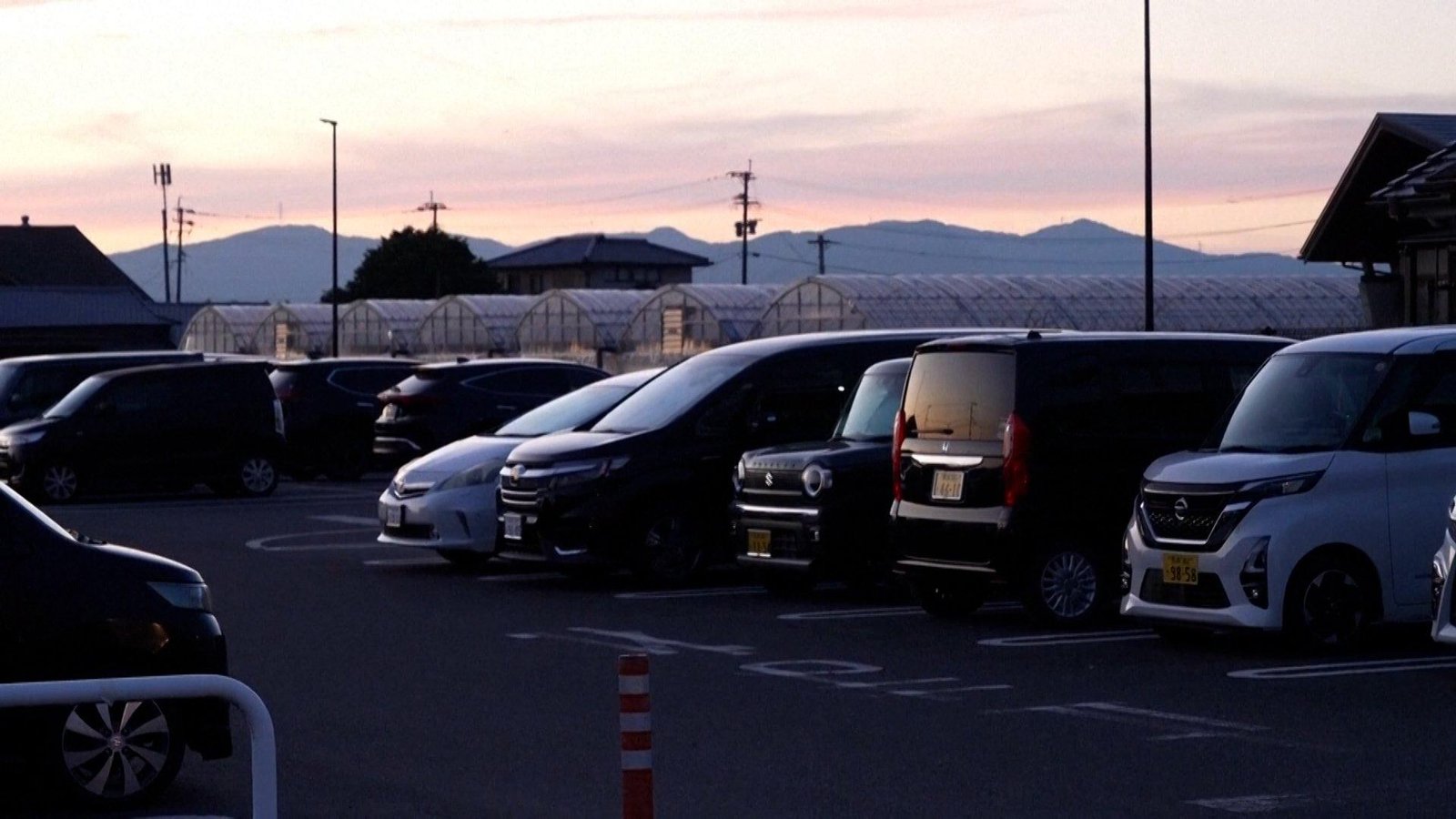Families sleep in cars after homes destroyed in Japan earthquake